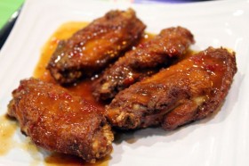 Crispy chicken wings flavored with one of the sauces.