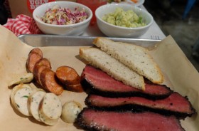 Certified angus brisket pastrami smoked 12 hours in pecan, Thai chile sausage, Texas hot links, apple slaw and potato salad